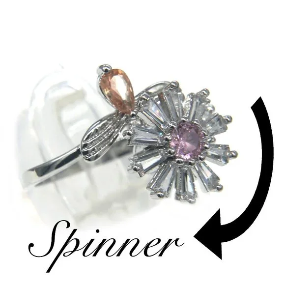 Silver ring with CZ Daisy, has pink center stone and topaz accent. - Picture 2 of 5